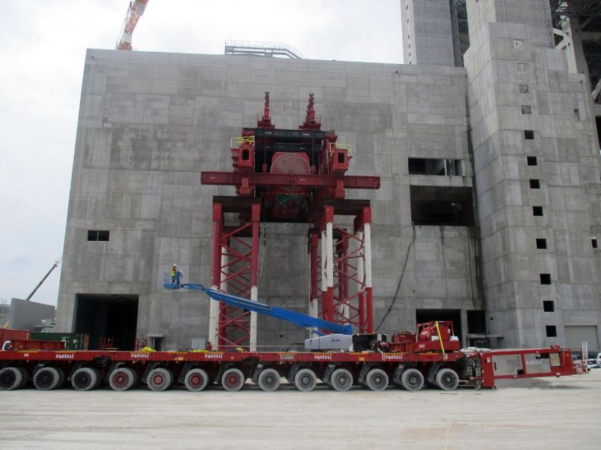 Heavy lifting by strand jacking tower and skidding system of a generator in Greece